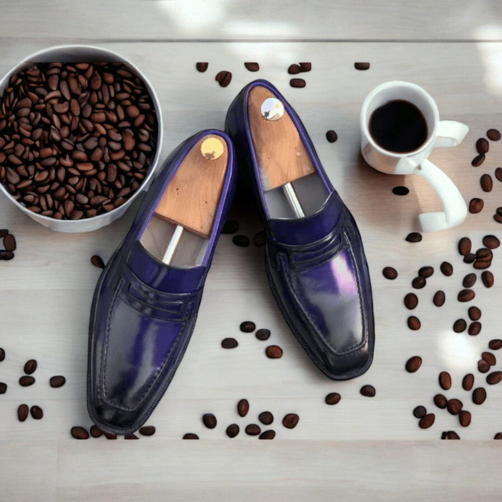 Handmade burgundy leather slip-on loafers for men, showcasing a stylish and casual design.