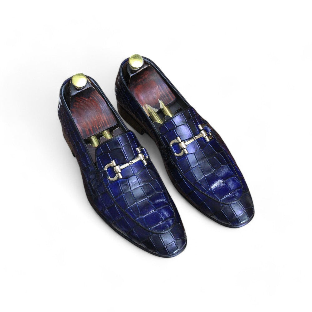 Elevate your style with these luxurious blue loafers crafted from alligator leather, featuring a chic buckle detail. Perfect for any occasion!