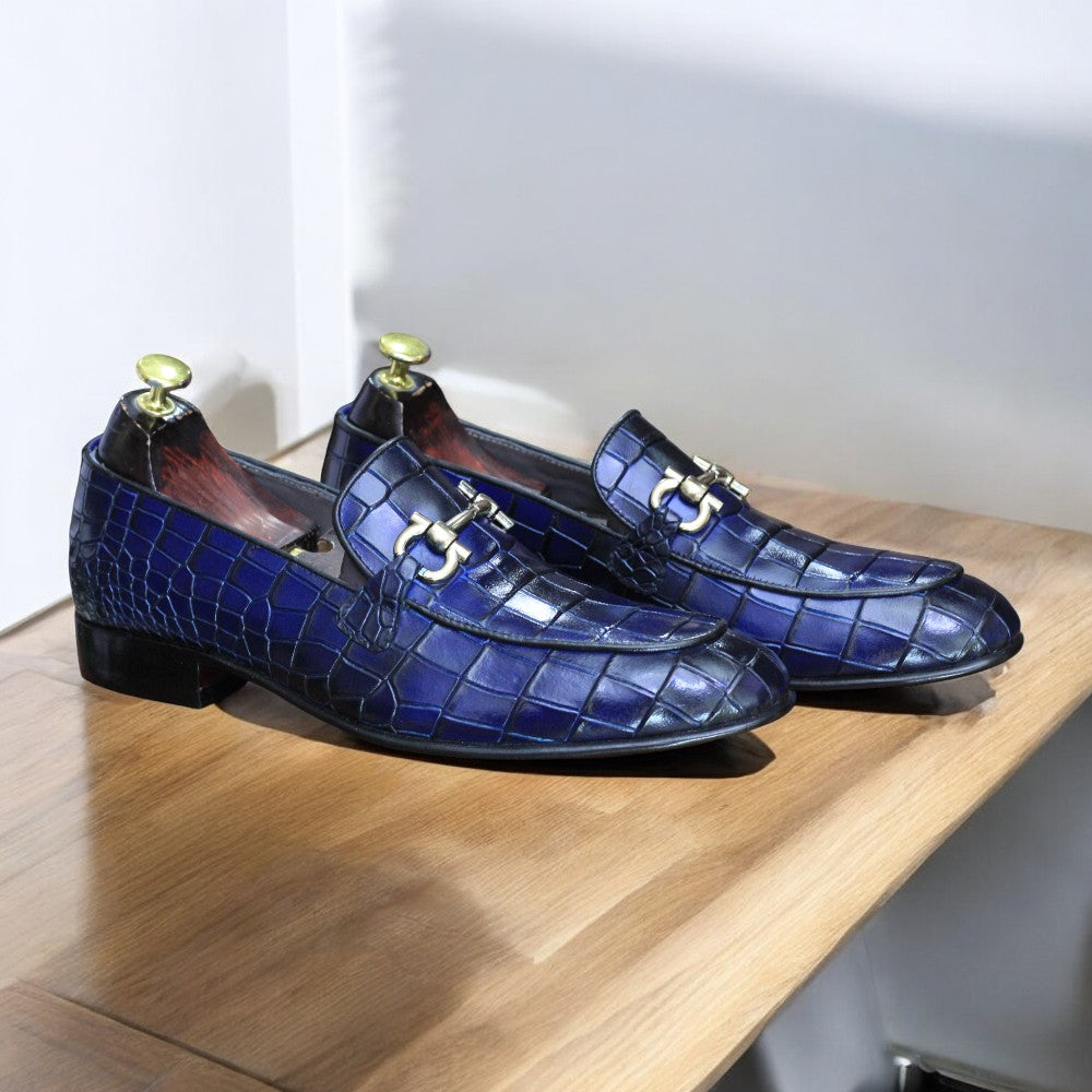 Elevate your style with these luxurious blue loafers crafted from alligator leather, featuring a chic buckle detail. Perfect for any occasion!