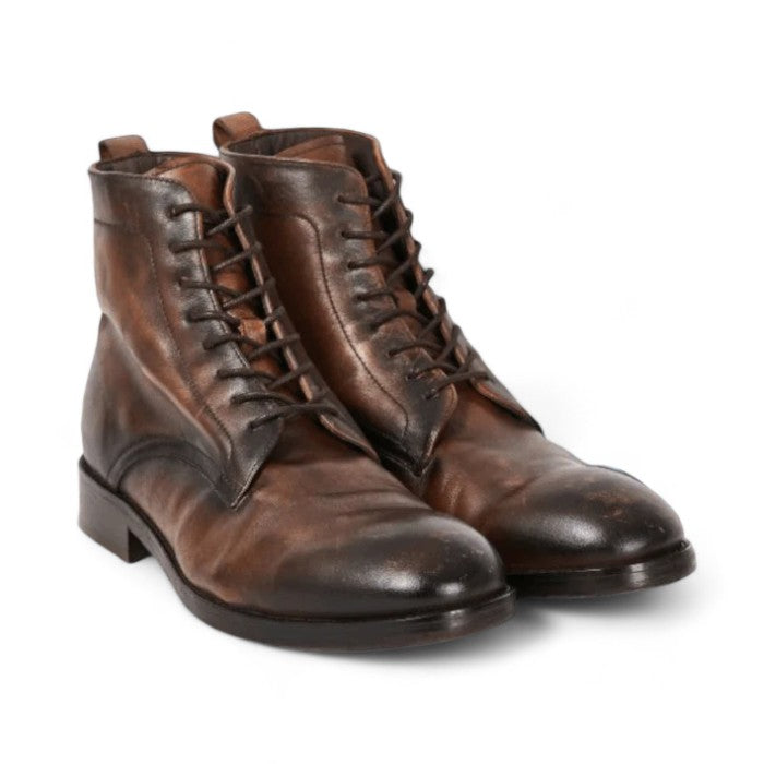 Men's brown leather ankle boots with a sleek design, featuring premium full-grain leather, cushioned insoles, and durable rubber soles for comfort and style.






